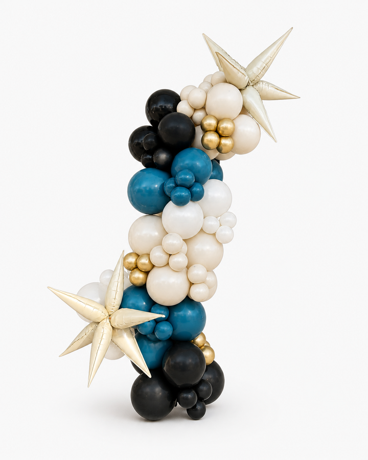 black, deep teal, beige, gold, and white balloon garland with star-shaped accents