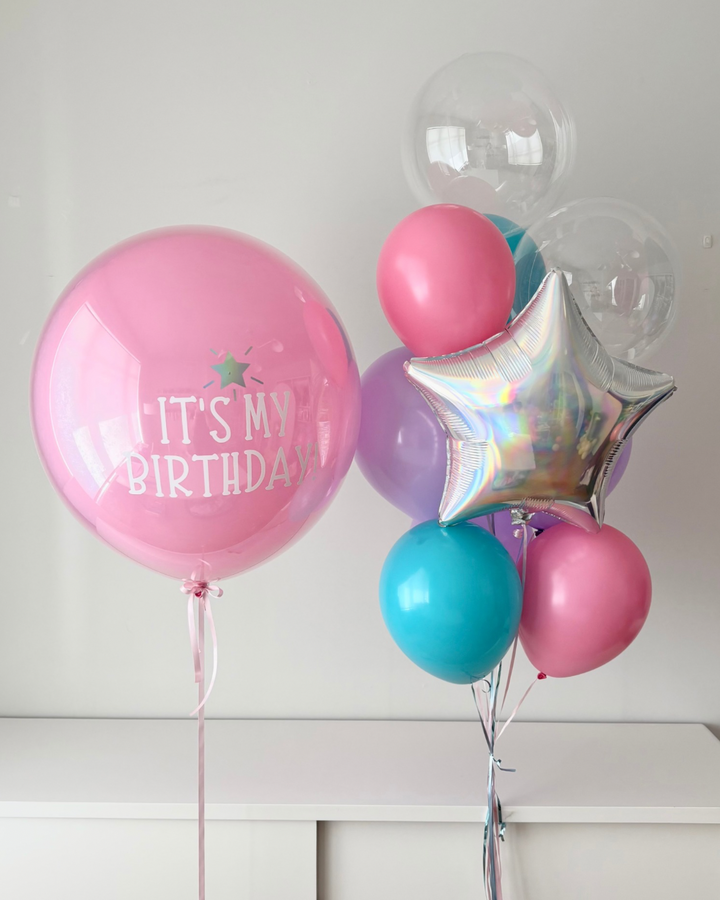 Jumbo balloon with custom text,  and helium bouquet with iridescent star and bubble balloons