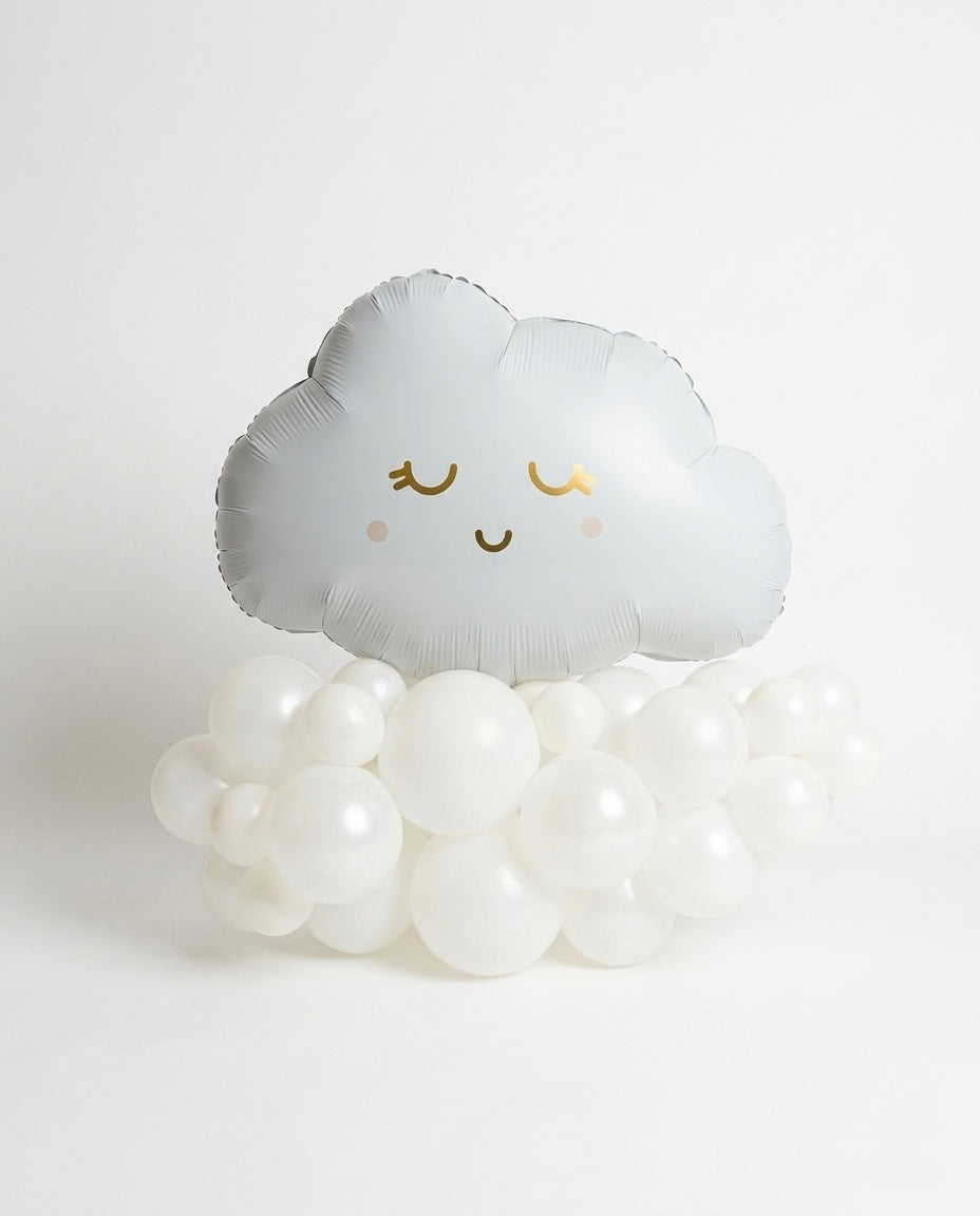 a smiley cloud balloon with pink and metallic gold accents, on white latex balloons arranged in a cloud shape on a white backdrop