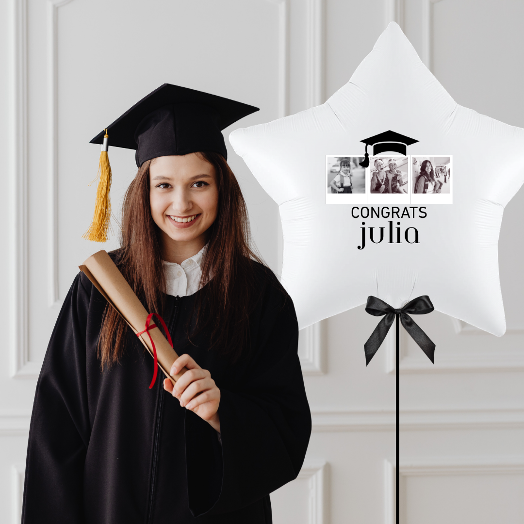 Graduate in cap and gown standing next to a &