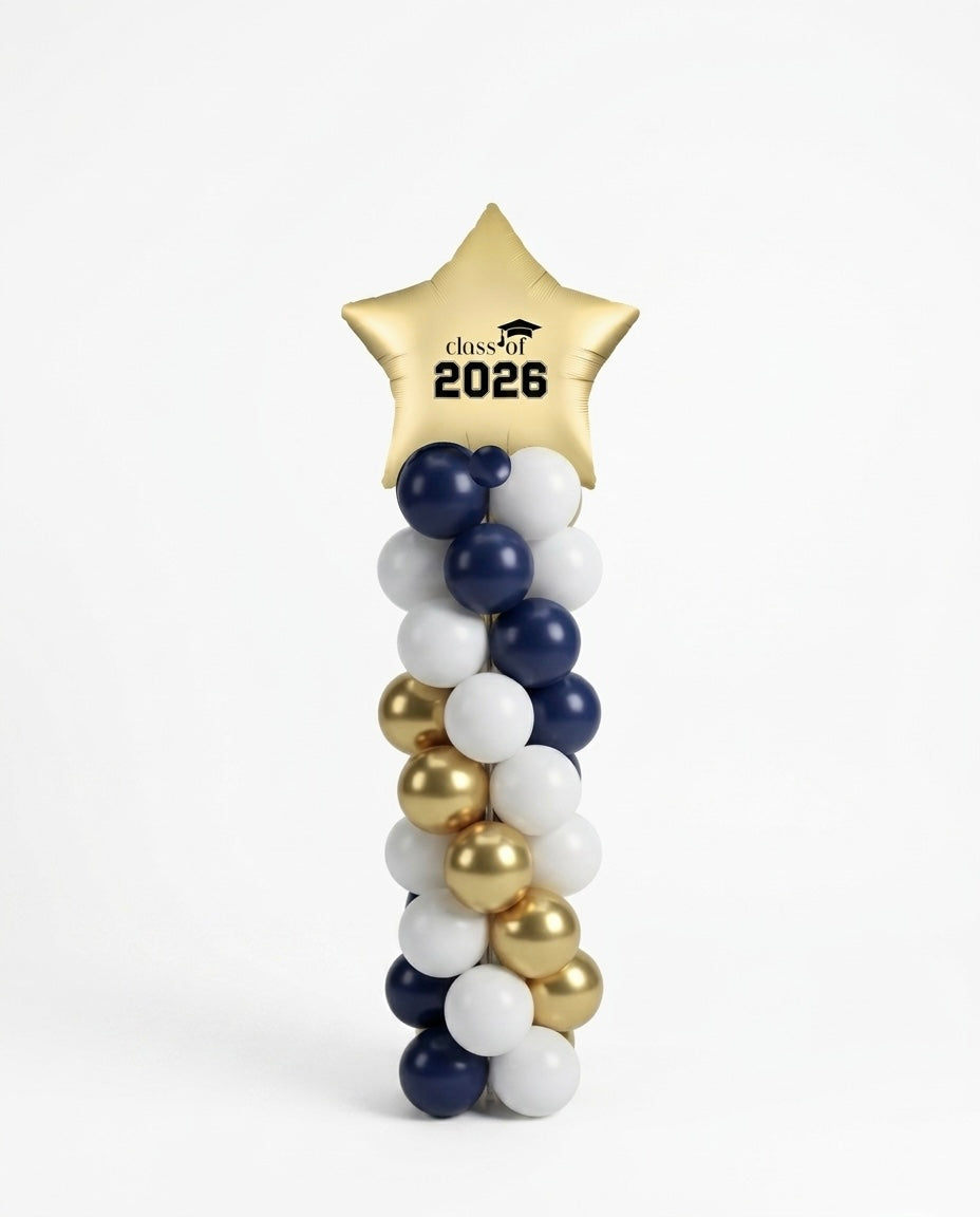 Graduation-themed balloon arch with a  'class of 2026' star balloon topper on a white background